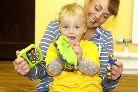 mom and baby with children's musical instruments