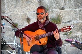 musician with a classical guitar at a concert