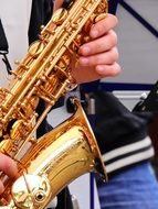 Photo of playing on the saxophone musician on the street