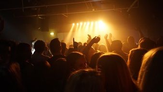 people at a dance concert in the spotlight