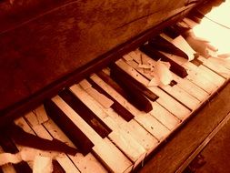 piano with damaged keyboard in monochrome image