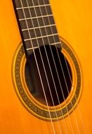 yellow wooden guitar close-up