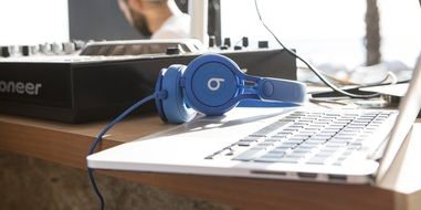 blue headphones, laptop and mixer