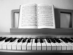 book with notes on the piano