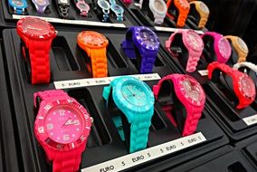 multi-colored wristwatches on stand