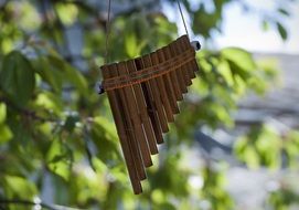 pan flute on wood as a garden decor
