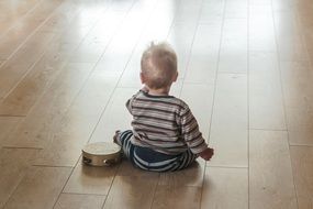 child sitting on the floor