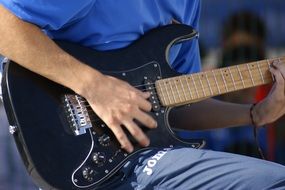 hands on guitar close up