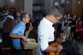 photo of a concert on guitars