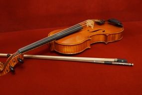 classical cello on a burgundy background