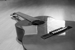 acoustic Guitar lays on floor, Black And White