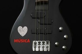 photo of black electric guitar
