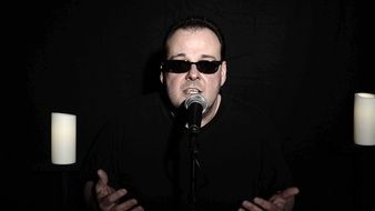 singer in sunglasses on stage