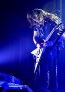 guitarist at a concert on a bright stage