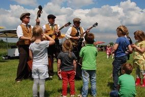 children near the orchestra