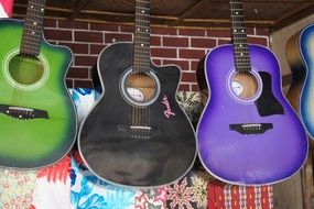 colorful guitars on the wall