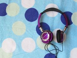 headphones on a bright wall
