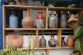 variety of vases on a rack