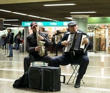 street musicians with saxophone and accordion