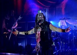 musician in a creepy mask at a concert