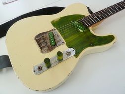 old electric guitar on white