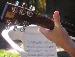 guitar player with an acoustic guitar in the sun