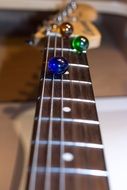 glass balls on the guitar strings