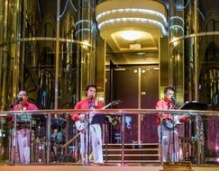musical group under stage lighting