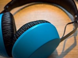 blue headphones are on the table close-up