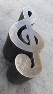 metal figurine of a musical key