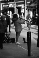 black and white photo of street musicians