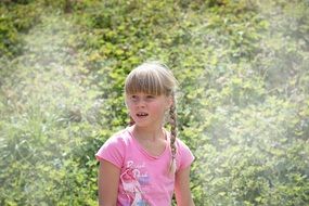 blonde girl with pigtails on the field