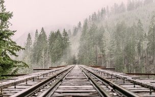 railway in the foggy alps