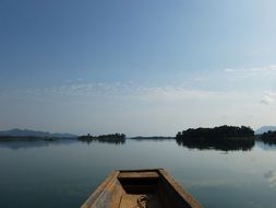 wooden boat on lake in tranquille landscape, Laos