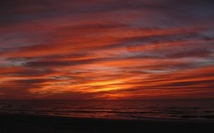 bright red sunrise over the sea