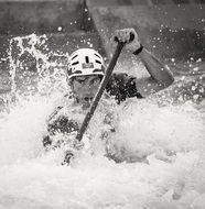 black and white photo of a man rafting