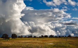 white surreal clouds over the countryside