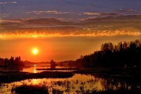 bright orange sunset over the lake