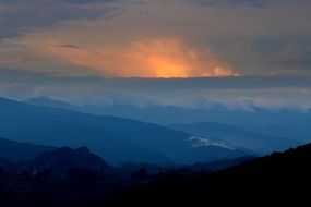 distant view of sunset in the mountains