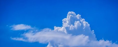 panorama picture of big white clouds on blue sky