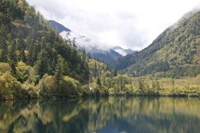 panorama of green mountains by the lake in China