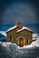 church among snowy mountains in Switzerland