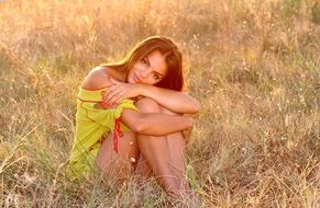 beautiful woman posing on the wild meadow