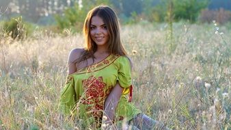 pretty woman posing on the wild field