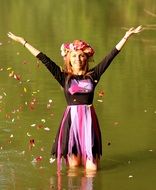 Girl Blonde in water with petals