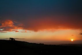silhouette of the hill on the background of dawn