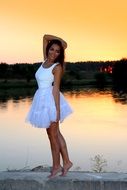 girl in white near the lake