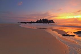 sunset on sandy beach