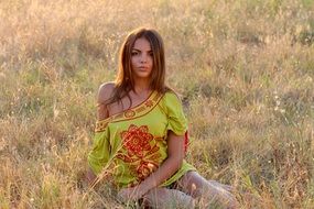 girl in the grass in the evening