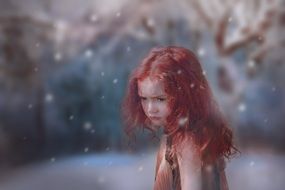 charming girl in a magical forest in a blurred background
